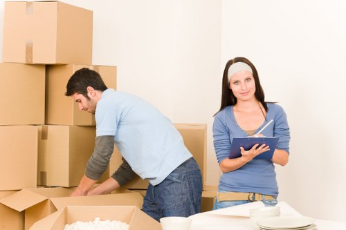 Experienced movers handling furniture carefully