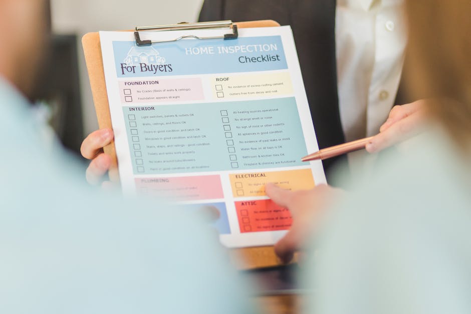 A person holding a clipboard with a home inspection checklist for buyers, featuring sections for foundation, roof, interior, plumbing, electrical, and attic. The checklist is printed on white paper wi